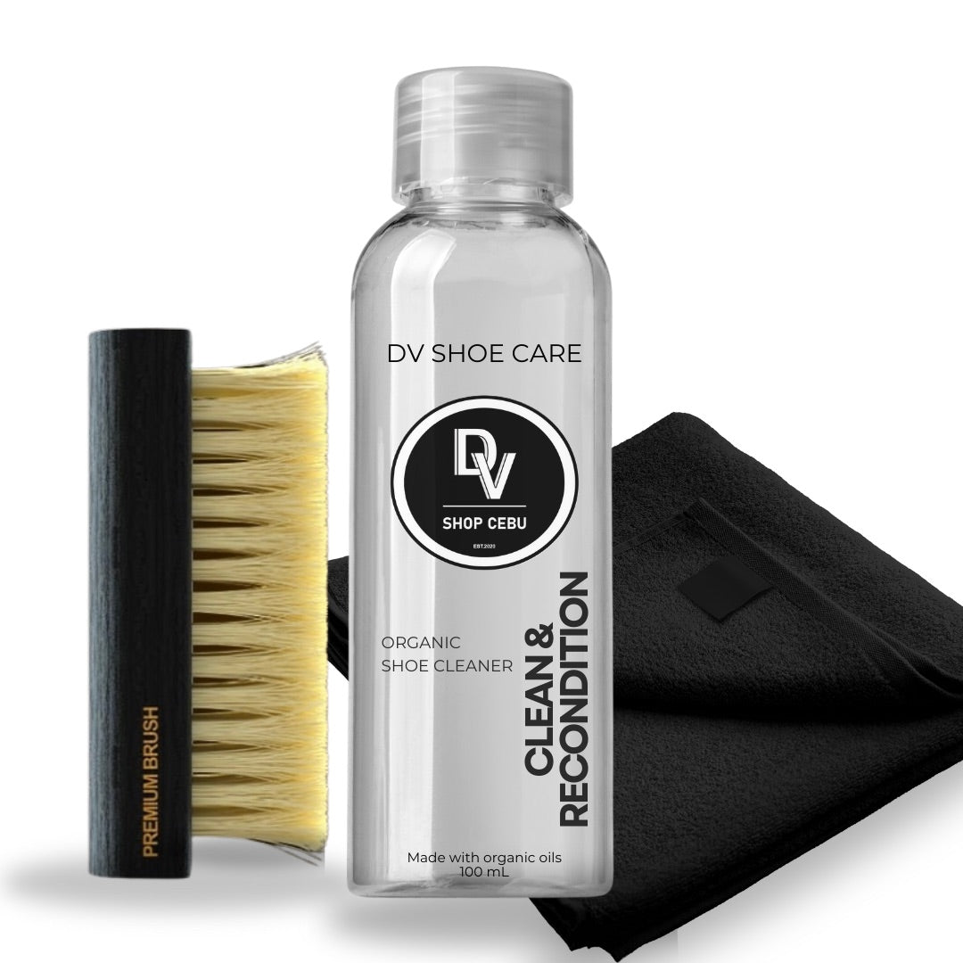DV Shoe Cleaner Kit with 100ml solution and premium brush displayed on a table