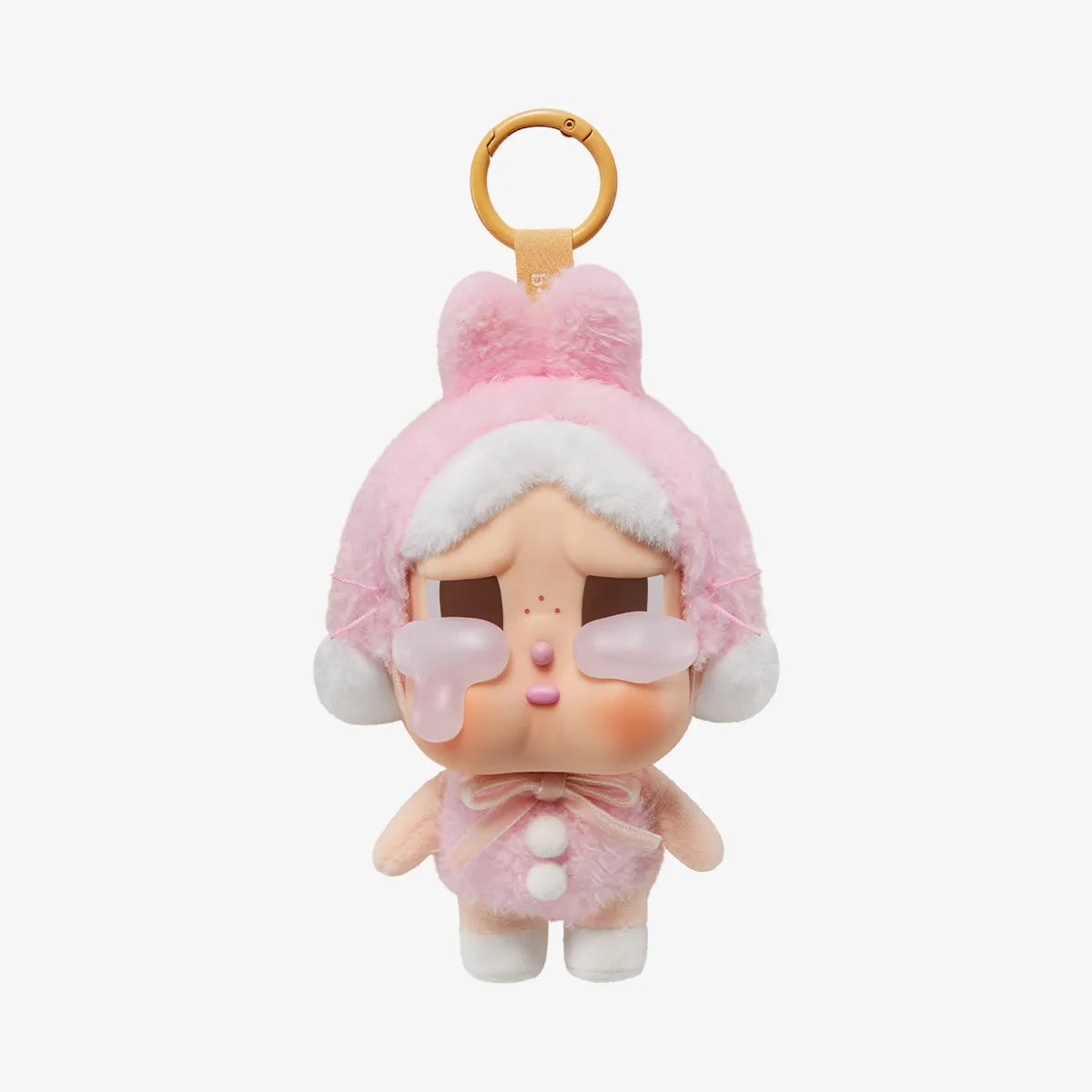 Close-up detail of vinyl face and tear on Crybaby plush
